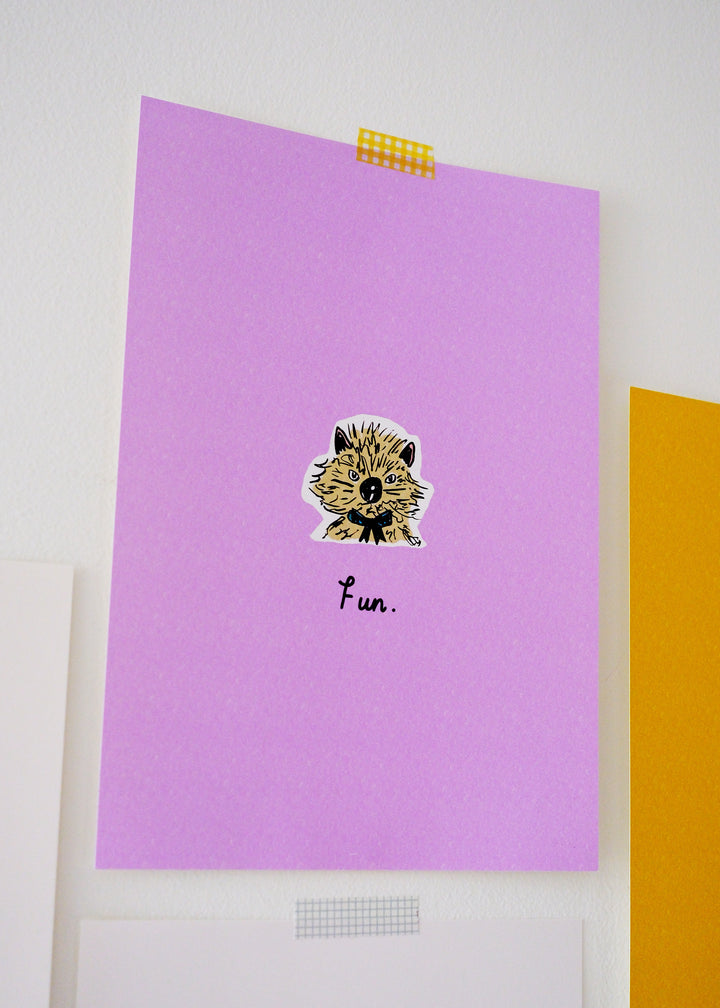 Purple paper with an illustration of a cat face and the word 'fun' on a white background.