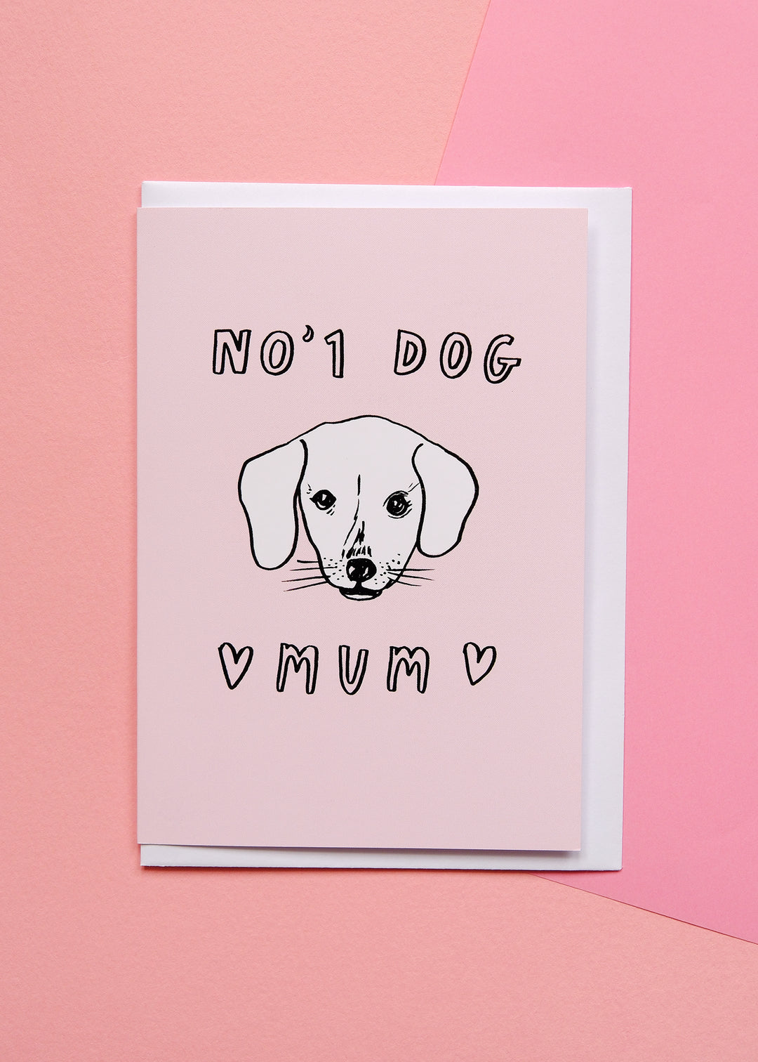 Greeting card with a dog illustration and text on a pink background