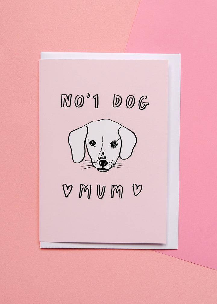 Greeting card with a dog illustration and text on a pink background
